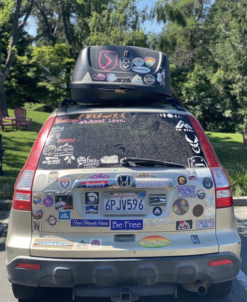 car covered in bumper stickers