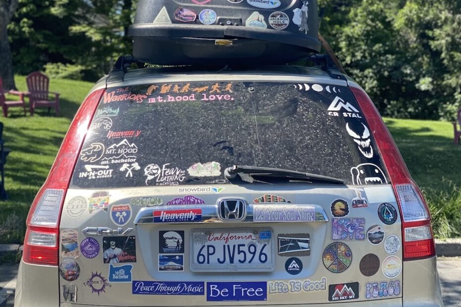 car covered in bumper stickers